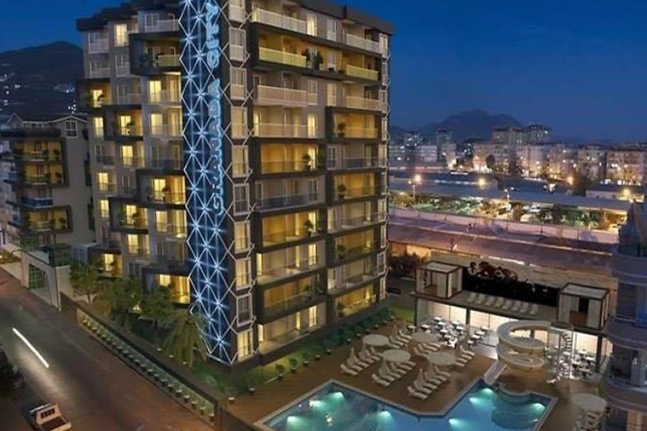 Luxe wonen in het hart van Alanya: 1 + 1 appartement voor investering Een appartement met een zwembad en beveiliging, dicht bij Cleopatra Beach Projec